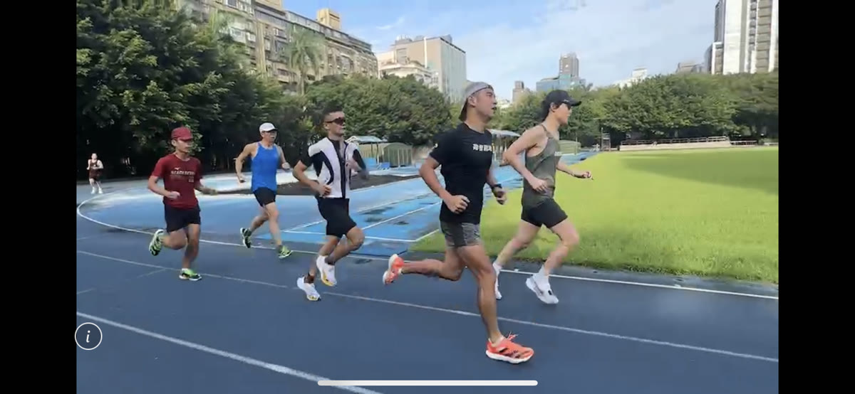 Teammates training together on the track